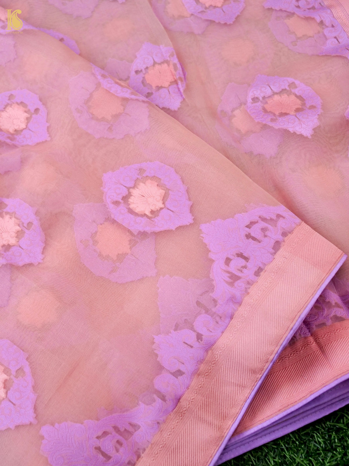 Handwoven blush pink Banarasi organza silk saree by Khinkhwab, featuring intricate Kora silk detailing and elegant drape.