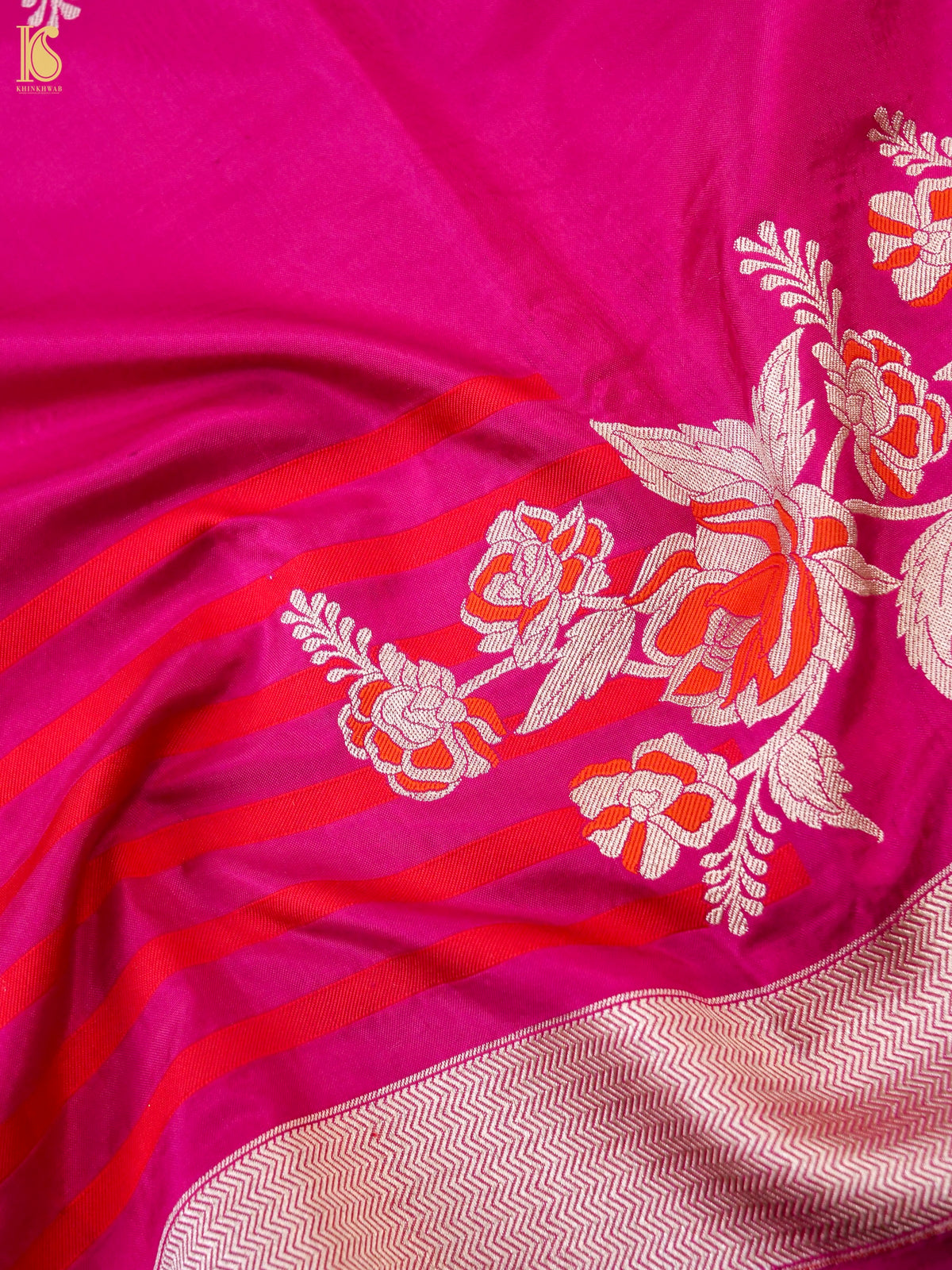 Rani pink Banarasi Katan Silk Ektara handwoven saree with intricate gold zari work, showcasing traditional craftsmanship.