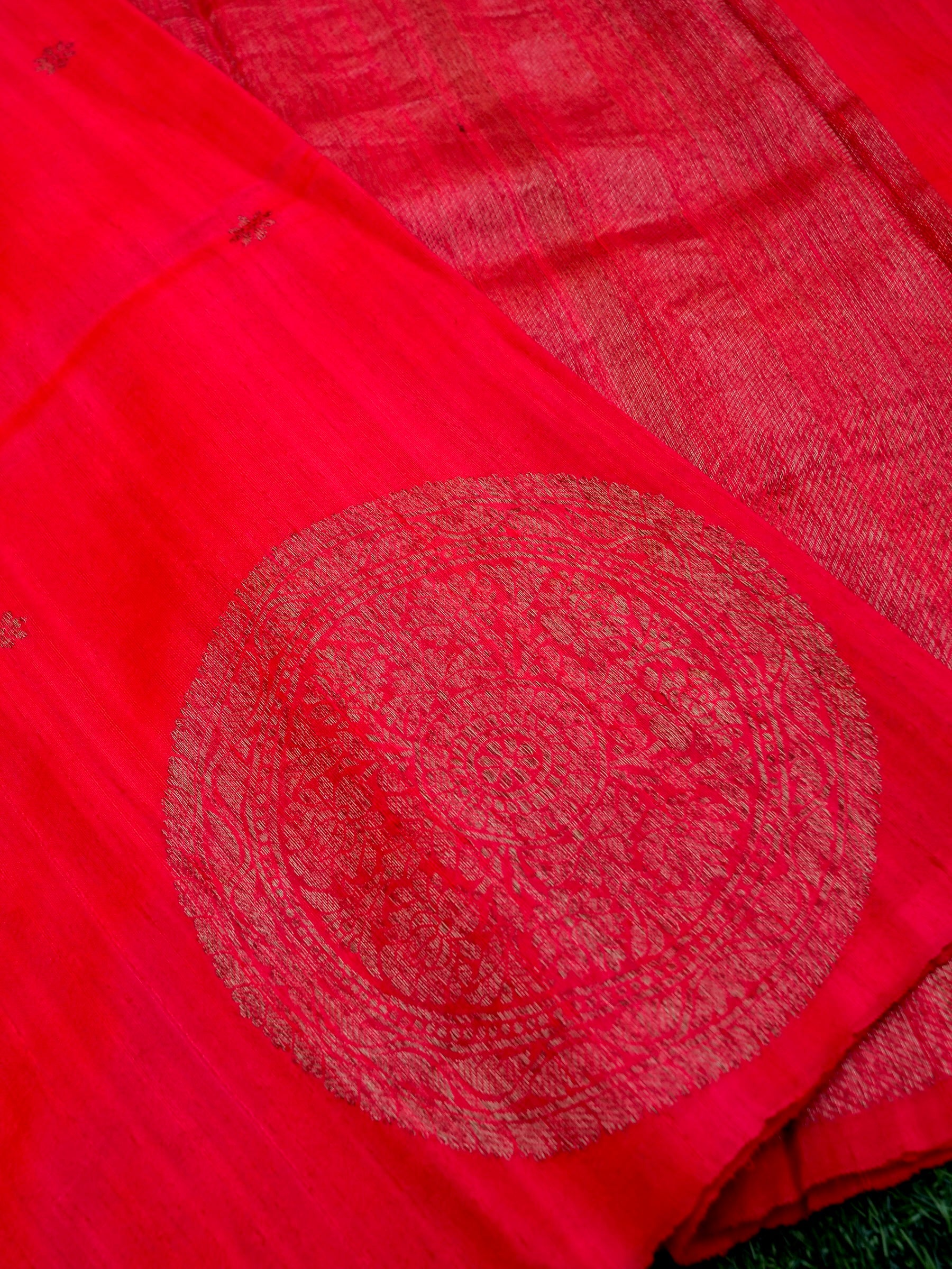 Close-up of a red fabric with circular patterns