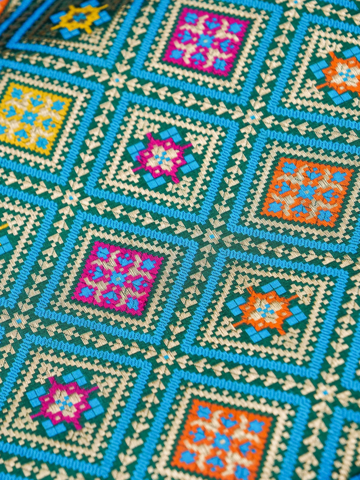 Handwoven Banarasi Katan Silk Patola Border Saree in Bottle Green and Blue