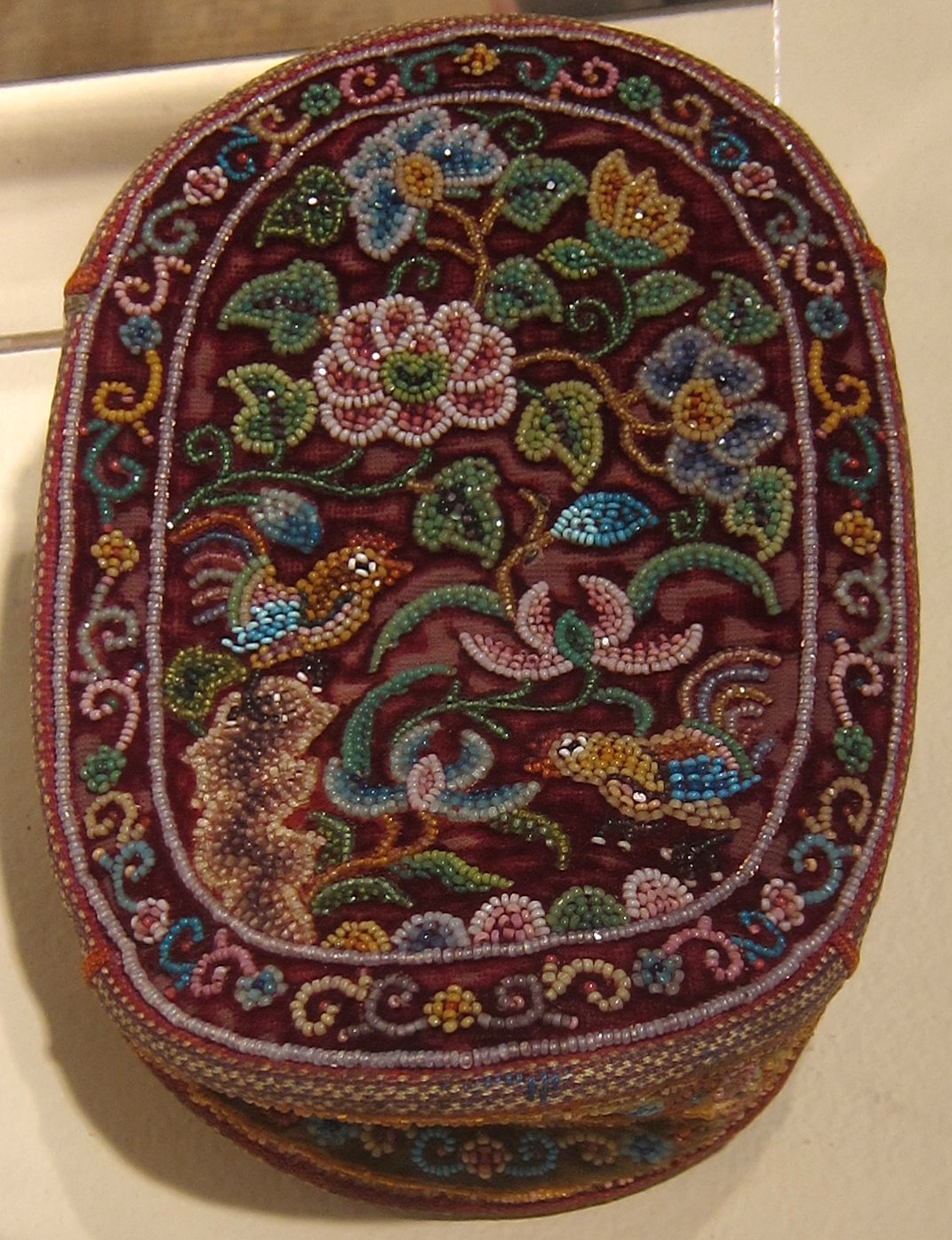 Peranakan woman’s beaded ceremonial purse with glass cut beads, via Wikimedia Commons