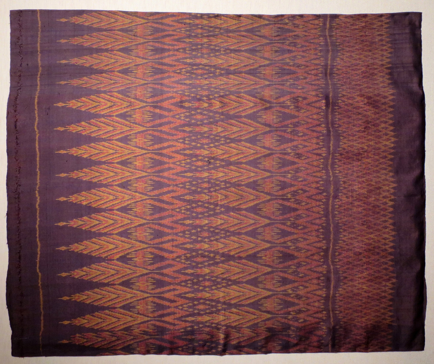 Thai silk sarong with weft ikat (mat mi) — via Wikimedia Commons