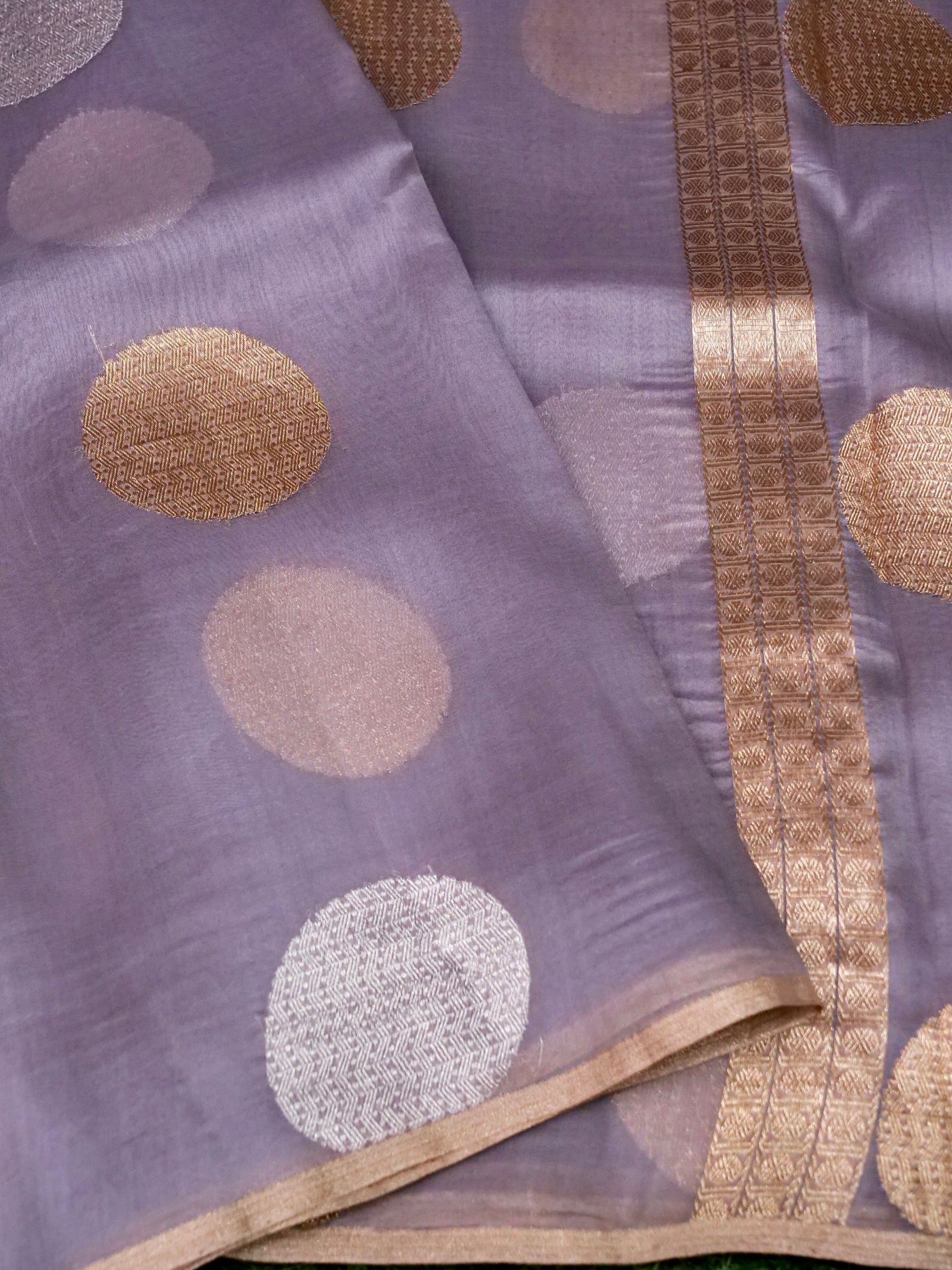Kora silk Kadwa Banarasi saree in dusty lilac with intricate handwoven floral patterns and rich organza border.
