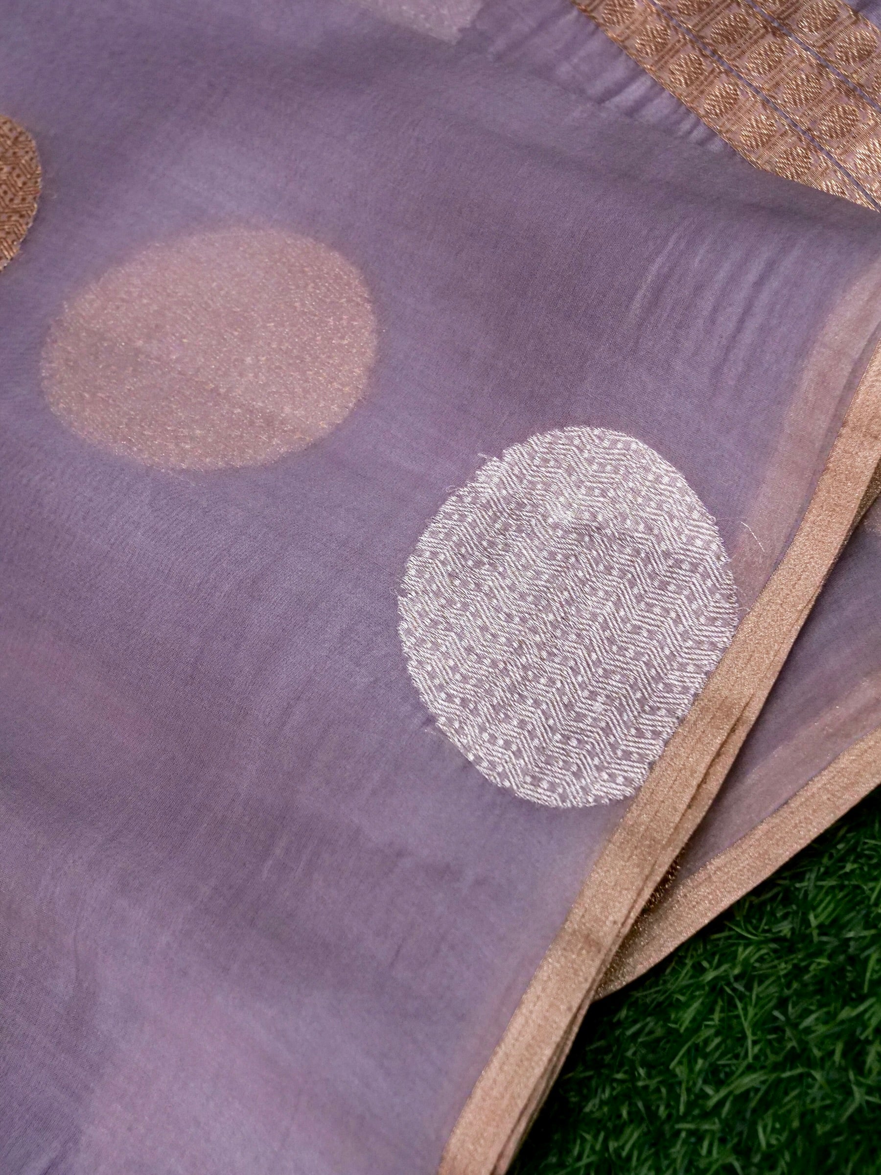 Kora silk Kadwa Banarasi saree in dusty lilac with intricate handwoven patterns and traditional zari work, by Khinkhwab.