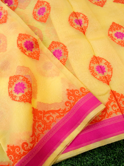 Handwoven Banarasi Organza Silk Saree in butter yellow by Khinkhwab, featuring intricate Kora embroidery and a delicate silk texture.