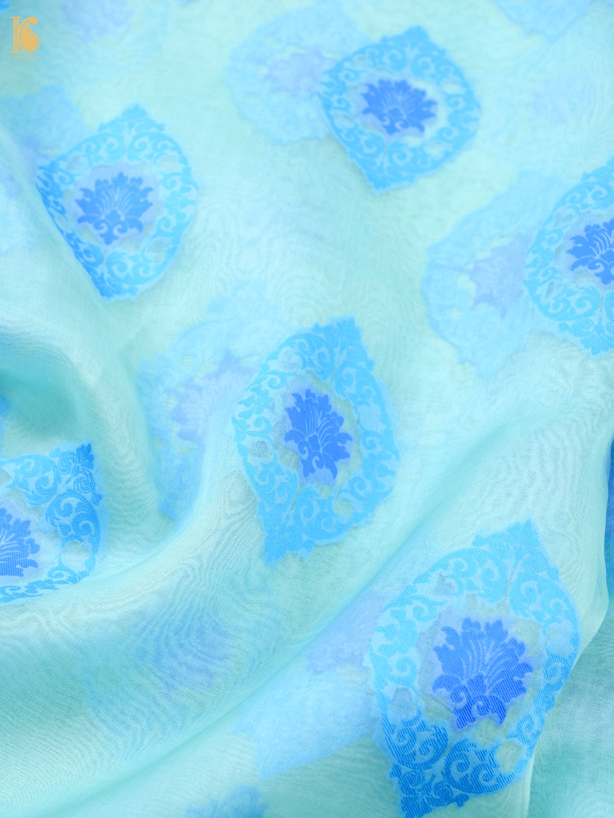 Handwoven Banarasi Organza Silk Saree in ice blue with intricate zari work, showcased on a traditional drape.