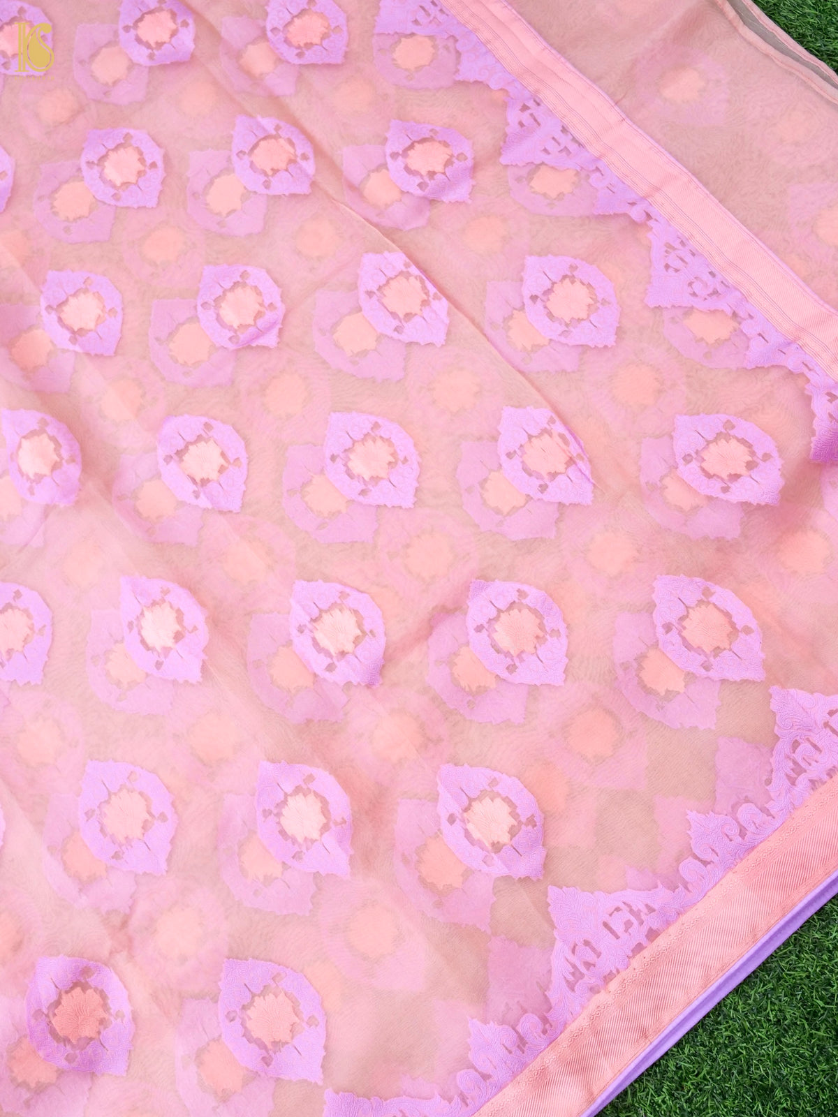 Handwoven blush pink Banarasi Organza Silk Saree with intricate Kora detailing by Khinkhwab, showcasing elegant traditional craftsmanship.