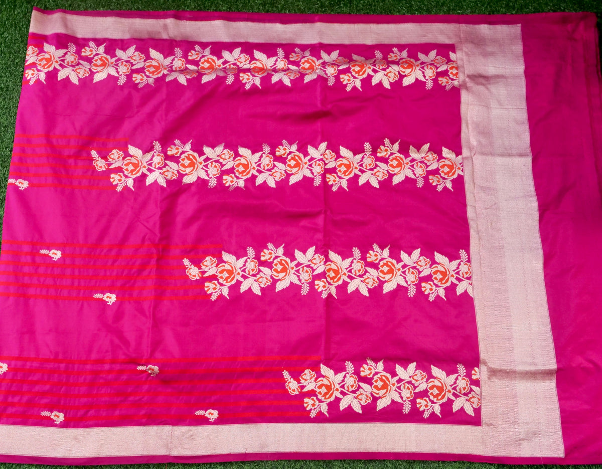 Rani pink Banarasi Katan Silk Ektara Handwoven Saree with intricate gold zari work, showcasing traditional craftsmanship.
